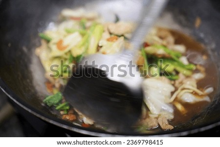 a spoon is being used to stir food..