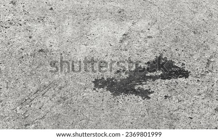 a black stain on the concrete.