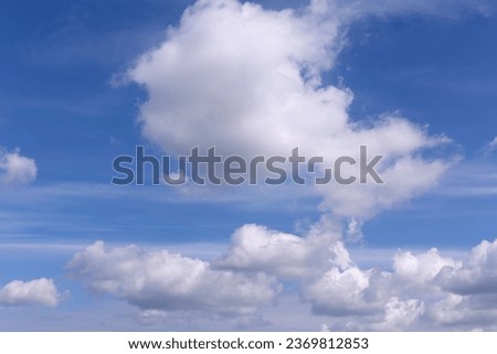 Serene Blue Sky with White Clouds