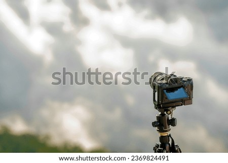 Vintage style Travel Holiday Relaxation Concept Camera. Sunrise clouds on a foggy mountaintop. Enjoy the beautiful cloud scenery.
