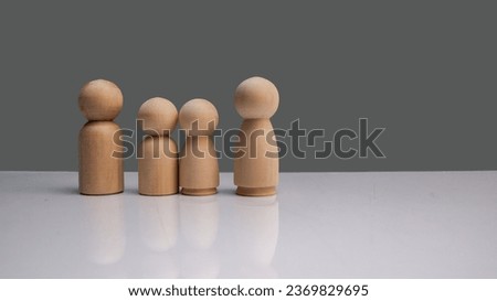 Wooden peg dolls men women and children , family day warmth happiness life insurance concept.