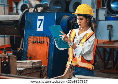 Metalwork manufacturing factory inspection, female engineer inspector with safety equipment conduct quality control on metal material in facility for heavy industry construction. Exemplifying