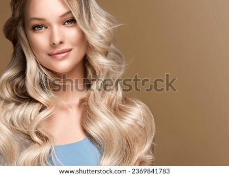 beautiful woman  hair coloring in ultra blond. Stylish  girl hairstyle curls done in a beauty salon. Fashion, cosmetics and makeup. Royalty-Free Stock Photo #2369841783