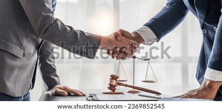 Successful consultations Consultation and meeting Lawyers and business professionals working and discussing with law firms in the office shake hands and congratulate each other.