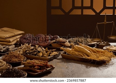 On the wooden table, different type of medicinal herbs displayed on wooden trays. Scene for medicine advertising, photography traditional medicine content. Blank space for presentation product
