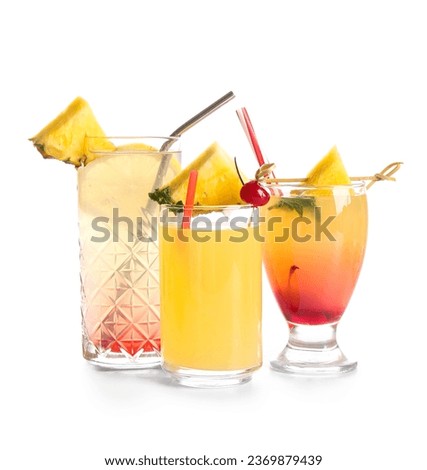 Glasses of tasty mai tai cocktail on white background