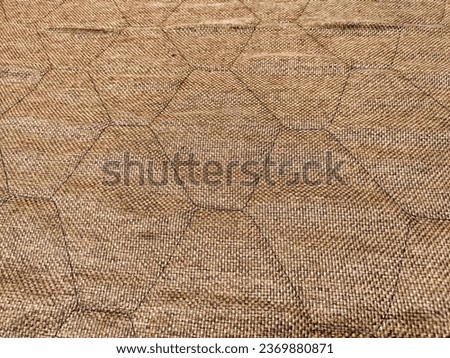 Rustic fabric factories matting, jute texture and background with honeycomb pattern. Abstract, frame, copy space, place for text Royalty-Free Stock Photo #2369880871