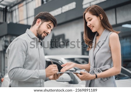 Car sale or rental concept, Dealership manager signing car insurance document or lease paper contract. Customer with car dealer agent making deal, sign on agreement document contract in office