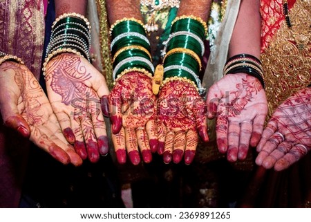Mehendi henna pattern on brides hand at a wedding, Mehndi hands close up Royalty-Free Stock Photo #2369891265