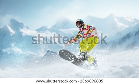 Young girl in sportswear sliding on snowboard over snowy mountains background. Winter activity. Concept of winter sport, action, motion, hobby, leisure time. Banner. Copy space for ad