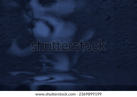 Dark Blue Stucco Table with Nature Shadow on Concrete Wall Texture Background, Suitable for Cosmetic Product Presentation Backdrop, Display, and Mock up. Royalty-Free Stock Photo #2369899199