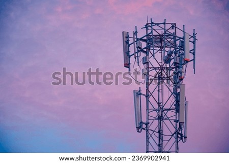 Telecommunication tower Antenna at sunset sky