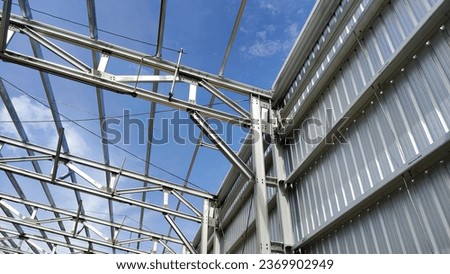 Construction frame of warehouse, lightsteel cladding and frame roof Royalty-Free Stock Photo #2369902949