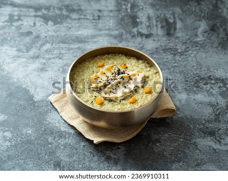 Abalone and Seaweed Rice Porridge Royalty-Free Stock Photo #2369910311