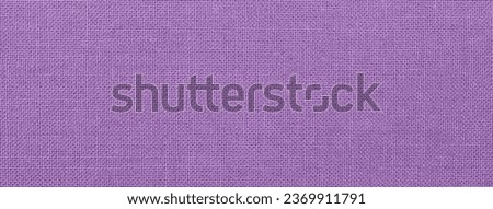 light purple background from a textile material. Fabric with natural texture. Cloth backdrop.