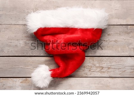 Santa hat with on grey wooden table