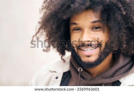 close-up of smiling black man with afro hair
