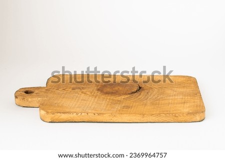 An isolated front view photo of a textured wooden cedar board.