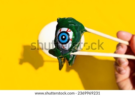Eye with slime in shape of human, creative idea for halloween.