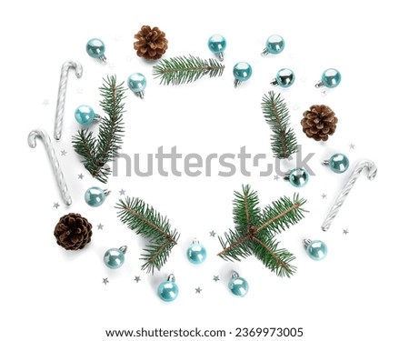 Frame made of colorful Christmas balls with fir branches and cones on white background