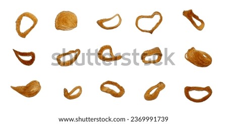 Set of fried red onions isolated on white background with clipping path. Crispy fried onion flakes, flat lay, top view. Also known as Bawang Goreng or Indonesian deep fried shallots. Royalty-Free Stock Photo #2369991739