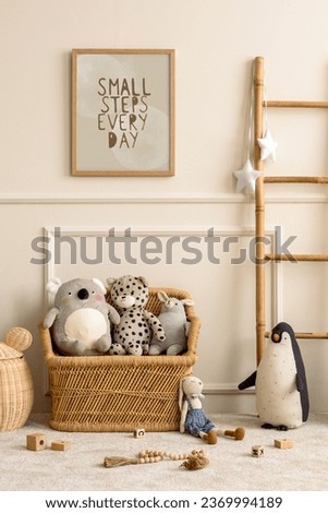 Cozy composition of kids room interior with mock up poster frame, wicker basket, plush animal toys, wooden blockers, white stool, beige wall with stucco and personal accessories. Home decor. Template.