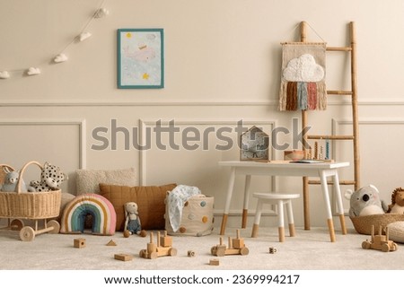 Warm and cozy kids room interior with mock up poster frame, beige wall with stucco, white desk, stool, pillows, plush animal toys, garland on the wall and personal accessories. Home decor. Template.