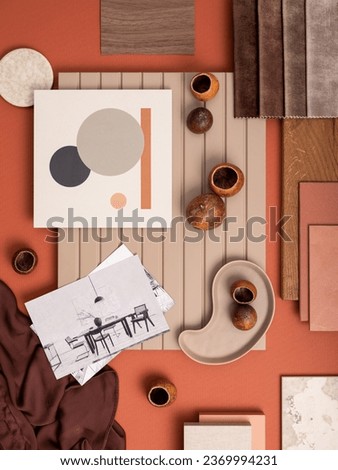 Colorful flat lay composition with textile and paint samples, panels and cement tiles. Stylish interior designer moodboard. Orange and beige color palette. Copy space. Template