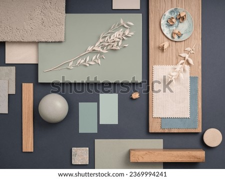 Elegant  flat lay composition in green, blue and beige color palette with textile and paint samples, lamella panels and tiles. Architect and interior designer moodboard. Top view. Copy space.