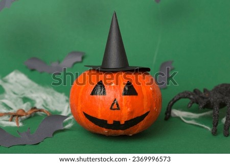 Halloween composition with jack o lanter decor on color background