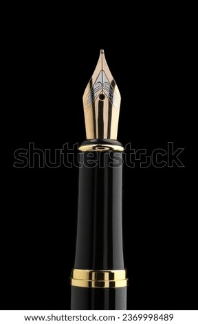 Beautiful fountain pen with ornate nib on black background Royalty-Free Stock Photo #2369998489