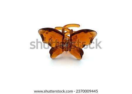 very trendy brown butterfly hair clip Royalty-Free Stock Photo #2370009445