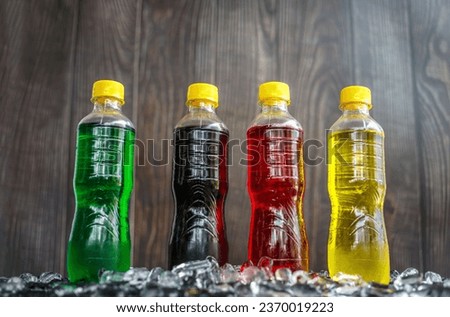 Low-angle view of Soft drink bottles Make the picture look grand or Carbonated beverages on ice, a lot of bottles of Soft drinks in colorful Chilled on ice and flavorful on the ice cubes