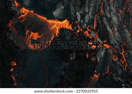 Aerial view of the texture of a solidifying lava field, close-up Royalty-Free Stock Photo #2370032955