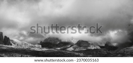 Rocky mountainside panorama in Cadini di Misurina in black and white, Dolomites, Italy Royalty-Free Stock Photo #2370035163