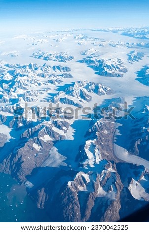 An aerial view of Green land with ice sheets.  Royalty-Free Stock Photo #2370042525