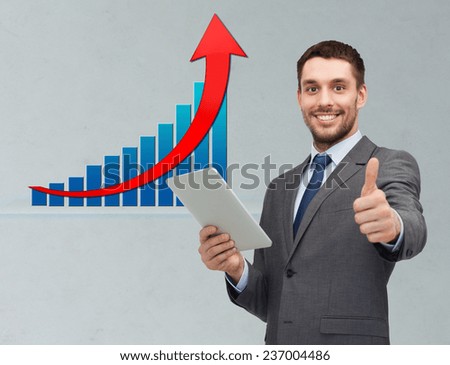 business, people, economics, technology and gesture concept - smiling businessman with tablet pc computer showing thumbs up over gray background and growth chart