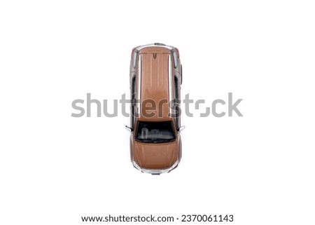 isolated simple brown suv car top view on white background that easily removable. Royalty-Free Stock Photo #2370061143