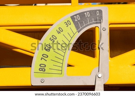 The scale of the protractor on the drilling rig. A scale for measuring the angle when drilling wells.