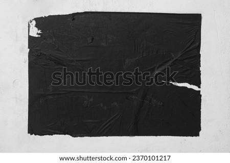 Old black street poster close up. Royalty-Free Stock Photo #2370101217