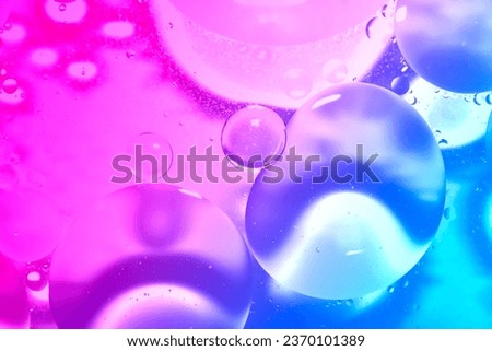 The picture of the oil on the water surface is soft and has rainbow gradations. Some parts are soft and unclear.