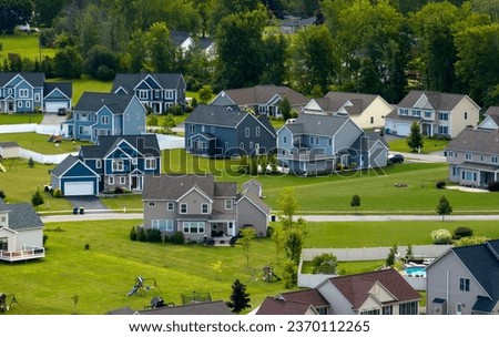 Housing market in the USA. Residential homes in suburban sprawl development in Rochester, New York. Low-density two story private houses in rural suburbs Royalty-Free Stock Photo #2370112265