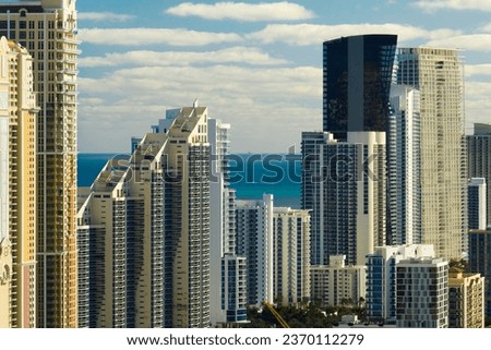 Expensive highrise hotels and condos on Atlantic ocean shore in Sunny Isles Beach city. American tourism infrastructure in southern Florida