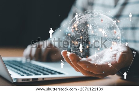 Businessman control global online marketplace and reach for customer engagement with insight data analytic, business intelligence. SEO marketing big data strategy for worldwide omnichannel market. Royalty-Free Stock Photo #2370121139