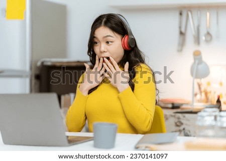 Young Asian woman uses mobile phone to listen to online radio