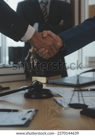 Consultation and conference of Male lawyers and professional businesswoman working and discussion having at law firm in office. Concepts of law, Judge gavel with scales of justice.
