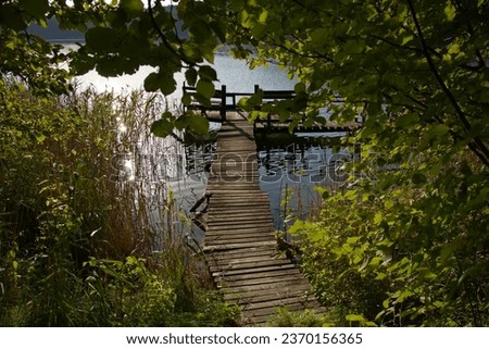 Old wooden pier on  the lake.  Lake on the Mazury Poland.
