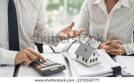 Business people signing contract making deal with real estate agent Concept for consultant home insurance
Real estate investment Property insurance security. Real estate agent offer house