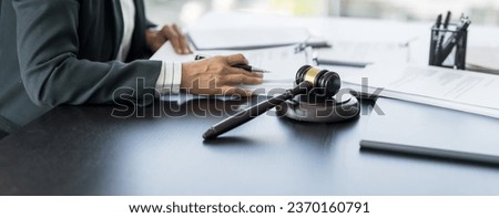 Lawyer businessman working with lawbook in office or courtroom Legal counsel with gavel and legal law. justice and lawyer concept Judge gavel hammer on Lawyer desk Royalty-Free Stock Photo #2370160791