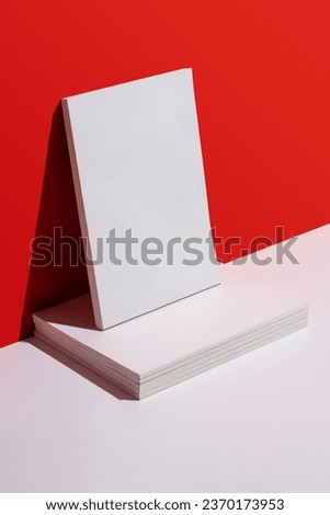 White blank cover magazine stack over red and white background. Magazine mockup.